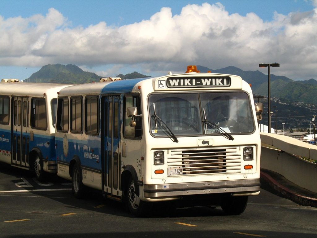Airport Shuttle Service Increases Frequency for Travellers shuttle bus outside airport terminal