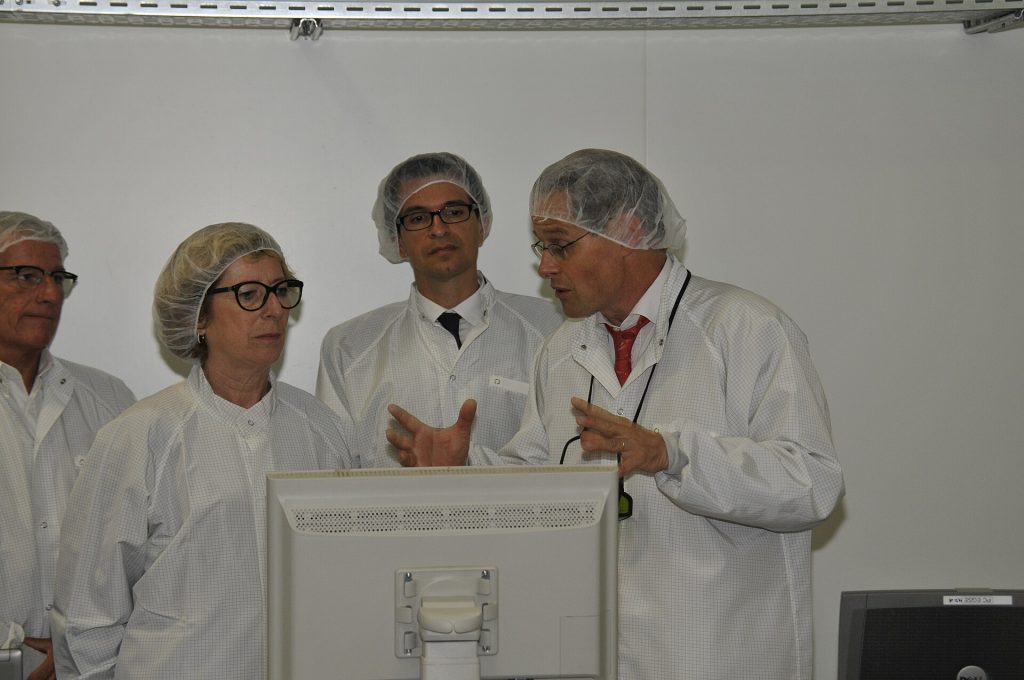 Japan to Back Two GlobalFoundries Chip Plants in New York With $21 Billion Semiconductor factory clean room with silicon wafer production equipment
